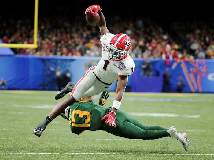 Jan 1, 2020; New Orleans, Louisiana, USA; Georgia Bulldogs wide receiver George Pickens (1) leaps over Baylor Bears cornerback Raleigh Texada (13) during the second quarter at the Mercedes-Benz Superdome.